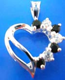 Sterling silver pendant in  heart love outline with 4 mini black and clear cz stone embedded on one side